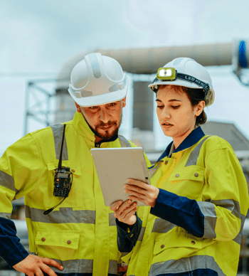 Engineers collaborating at an industrial site
